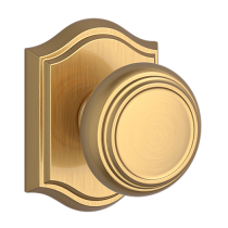 Baldwin Reserve Traditional Knob shown with Arch Rose in Lifetime Satin Brass (044)